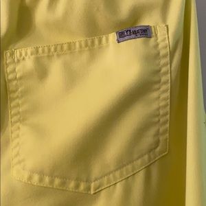 Preowned Scrub floral  top  and yellow pants.